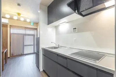 a kitchen with a sink and a counter top at Asakusa Miyabi no mori in Tokyo