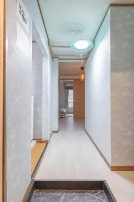 a hallway of an office building with a light fixture at Minowa Sta Direct to Ueno in Tokyo