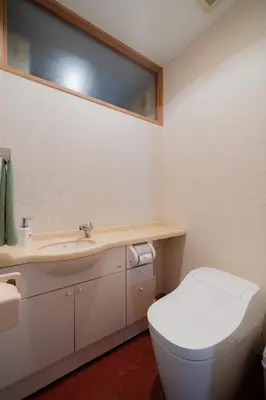 a bathroom with a white toilet and a sink at Mita Hillside Villa 4BR 3Bathrooms in Tokyo