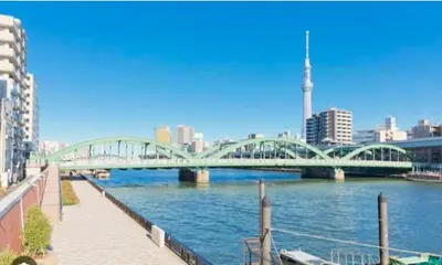 a bridge over a river in a city at jtr\u6d45\u8349\u6a4b301 in Tokyo