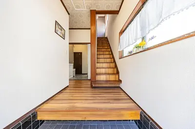a hallway of a house with wooden floors and a window at ODYSSEY Tokyo Skytree in Tokyo