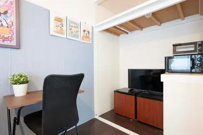 a room with a desk and a television and a chair at Shibuya Station 8-min walk, Shibuya Center, 3 people stay, WIFI, 4F No elevetor in Tokyo