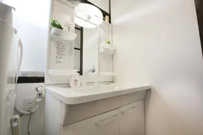 a bathroom with a white sink and a mirror at Full facilities 9PPL CozyHouse1 stop-Yamanote Line in Tokyo