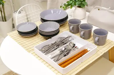 a tray of utensils sitting on a table with plates at \u6953\u5c4b1F 120Ta in Tokyo