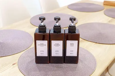 two bottles of soap sitting on top of a table at \u6953\u5c4b1F 120Ta in Tokyo