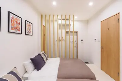 a bedroom with a large bed and a closet at \u6953\u5c4b1F 120Ta in Tokyo