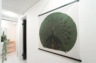 a picture of a peacock painting on a wall at Near Asakusa and Ueno, Spacious 3BR House, Max 8 People in Tokyo