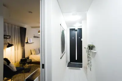 a hallway leading to a room with a bedroom at Near Asakusa and Ueno, Spacious 3BR House, Max 8 People in Tokyo