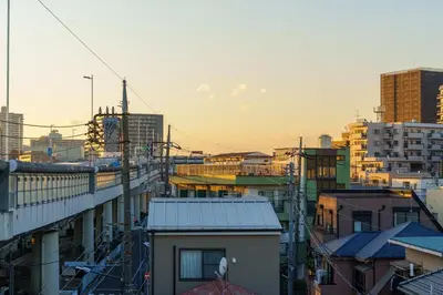 a view of a city with a train at \u6953\u5c4b\u30a2\u30cd\u30c3\u30af\u30b9 120Tb in Tokyo