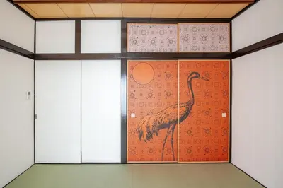 a painting of a bird on the wall of a room at Y's INN Ikebukuro 013T in Tokyo