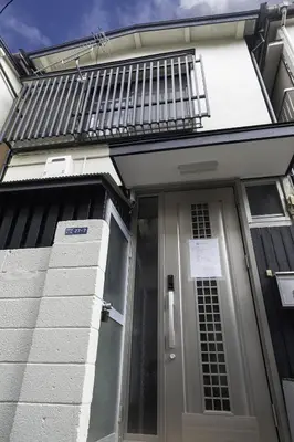 a front door of a house with a sign on it at \u5927\u718a\u306e\u5bb6 028t in Tokyo