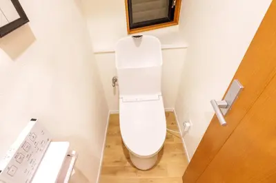 a bathroom with a white toilet in a room at MINE HOME\u91ce\u65b9 121t in Tokyo