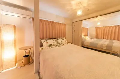 a small bedroom with a bed and a window at \u697d\u5bbfSUMIDA 002t in Tokyo