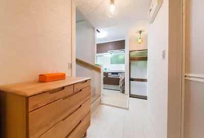 a kitchen with a wooden counter and a hallway at \u697d\u5bbfSUMIDA 002t in Tokyo