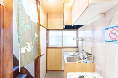 a small kitchen with a sink and a window at Y's INN 押上 115T in Tokyo