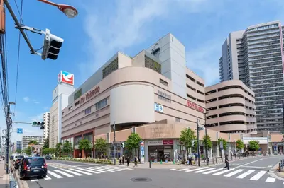 a building on a city street with a traffic light at Y's INN 押上 115T in Tokyo