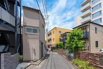 an empty street in a city with buildings at Y's INN 押上 115T in Tokyo