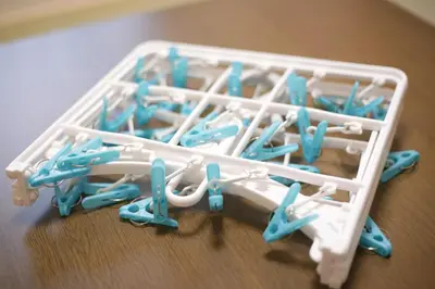 a plastic container filled with lots of blue toothbrushes at \u5922\u306e\u5929\u7a7a\u6a39 027t in Tokyo