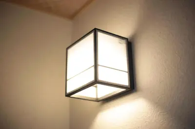 a light fixture on a wall in a room at \u5922\u306e\u5929\u7a7a\u6a39 027t in Tokyo