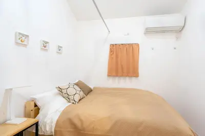 a small bedroom with a bed and a window at 132T close \u5922\u306e\u5bbf \u7ffc in Tokyo