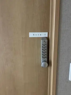 a door with a remote control on it at Haneda Base in Tokyo