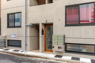 a building with a door on the side of it at jtr\u6d45\u8349\u6a4b302 in Tokyo