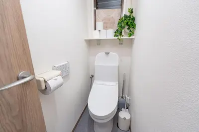 a bathroom with a white toilet in a room at Y's INN 駒込 110T in Tokyo