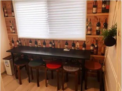 a bar with a bunch of bottles of wine at \u4e09\u30ce\u8f2a101 in Tokyo
