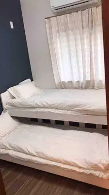 two bunk beds in a room with a window at \u4e09\u30ce\u8f2a101 in Tokyo