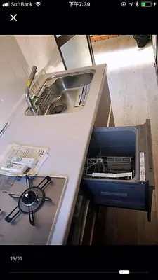 a kitchen counter with a sink and a dishwasher at \u4e09\u30ce\u8f2a401 in Tokyo