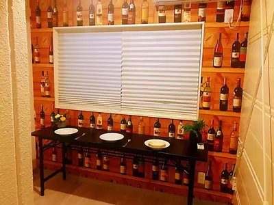 a large window in a room with bottles of wine at \u4e09\u30ce\u8f2a401 in Tokyo