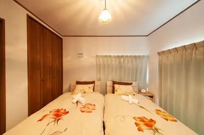 a bedroom with two beds with crabs on the covers at \u697d\u5bbf \u58a8\u7530II 003t in Tokyo