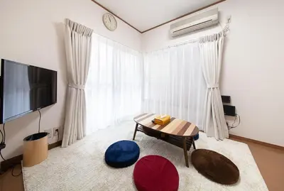 a living room with a coffee table and a television at \u697d\u5bbf \u58a8\u7530II 003t in Tokyo