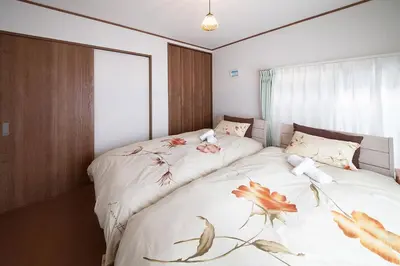 a bedroom with two beds with fish drawings on them at \u697d\u5bbf \u58a8\u7530II 003t in Tokyo