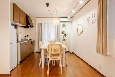 a kitchen and dining room with a table and chairs at \u512a\u697d\u82d1 113t in Tokyo