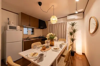 a kitchen with a table with plates of food on it at \u512a\u697d\u82d1 113t in Tokyo