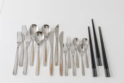 a group of utensils arranged in a row at \u512a\u697d\u82d1 113t in Tokyo