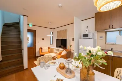 a kitchen and living room with a table in a room at \u512a\u697d\u82d1 113t in Tokyo