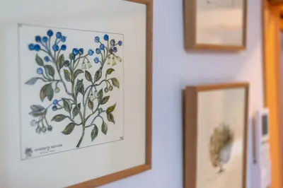 a picture of blueberries on a wall next to a mirror at \u697d\u9038 026t in Tokyo
