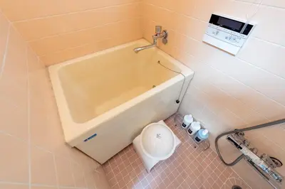 a bathroom with a toilet and a bath tub at \u697d\u9038 026t in Tokyo
