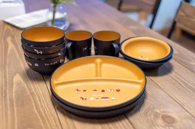 a table with three plates and bowls on it at \u697d\u9038 026t in Tokyo