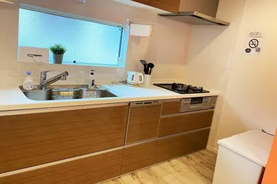 a kitchen with a sink and a window at Y's INN Nakai 005T in Tokyo