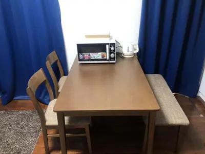 a wooden table with a toaster on top of it at Y's INN Nirinso 001T in Tokyo