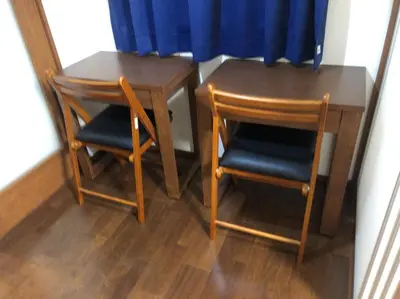 two chairs and a table and a table and a table at Y's INN Nirinso 001T in Tokyo