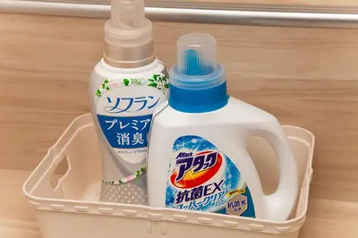 two bottles of bleach in a plastic container at Y's INN 有客 015T in Tokyo
