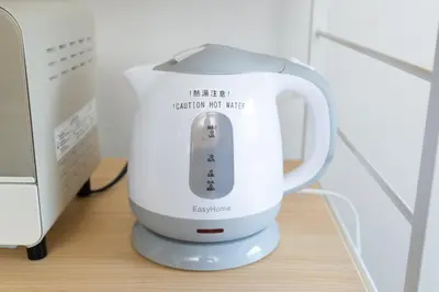 a white blender sitting on top of a table at Y's INN Tsutusji 014T in Tokyo