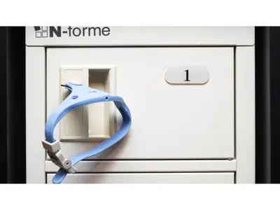 a picture of an im frame with a blue ribbon at First Cabin Ichigaya 