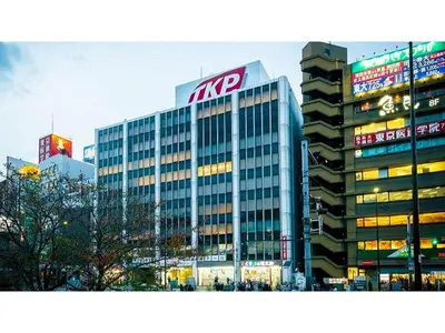 a large office building with a kyro sign on it at First Cabin Ichigaya 