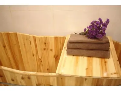 a vase of purple flowers sitting on top of a wooden tub at MIYAVI hotel - Vacation STAY 75556v in Tokyo