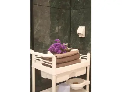 a bathroom with a white towel rack with purple flowers at MIYAVI hotel - Vacation STAY 75556v in Tokyo